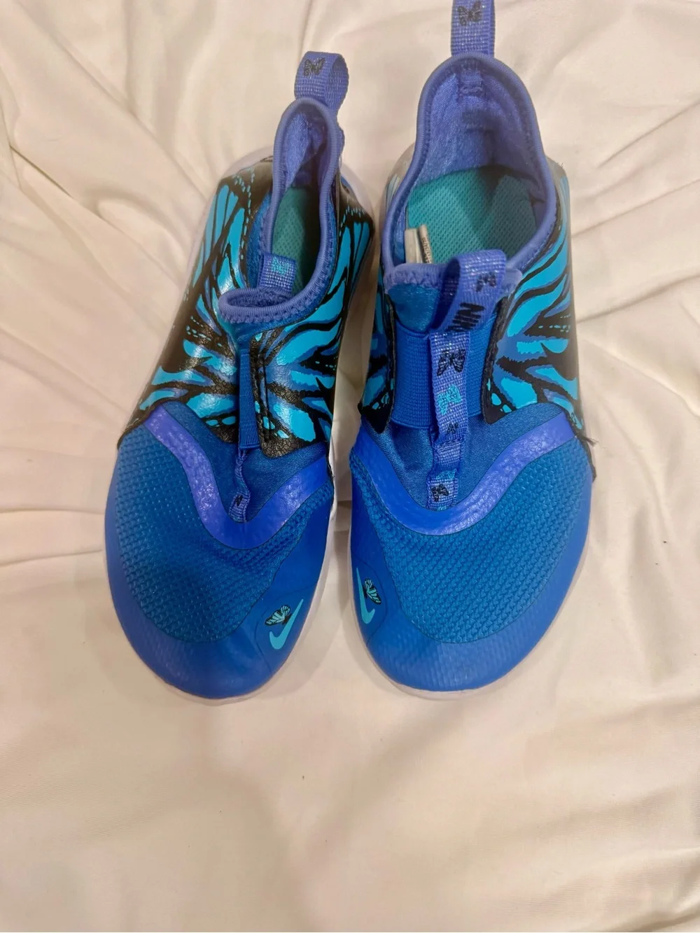 Nike Kids Blue Slip-On Sneakers with Teal and Black Accent